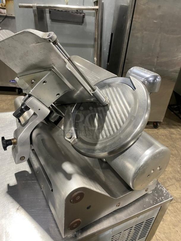 Globe electric deli meat slicer on legs, stainless steel, commercial grade, knife feed, used condition.