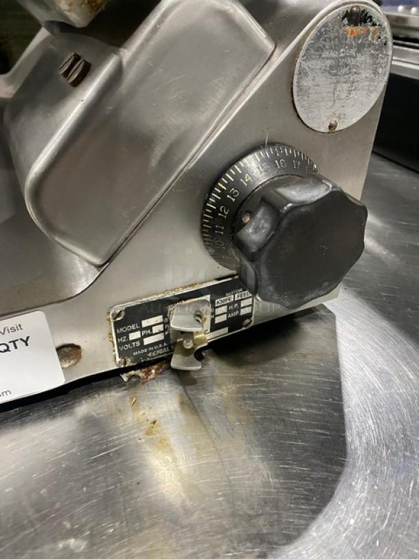 Globe Commercial Electric Powered Deli Meat Slicer on Legs; features adjustment dial, power and voltage labels; used condition.