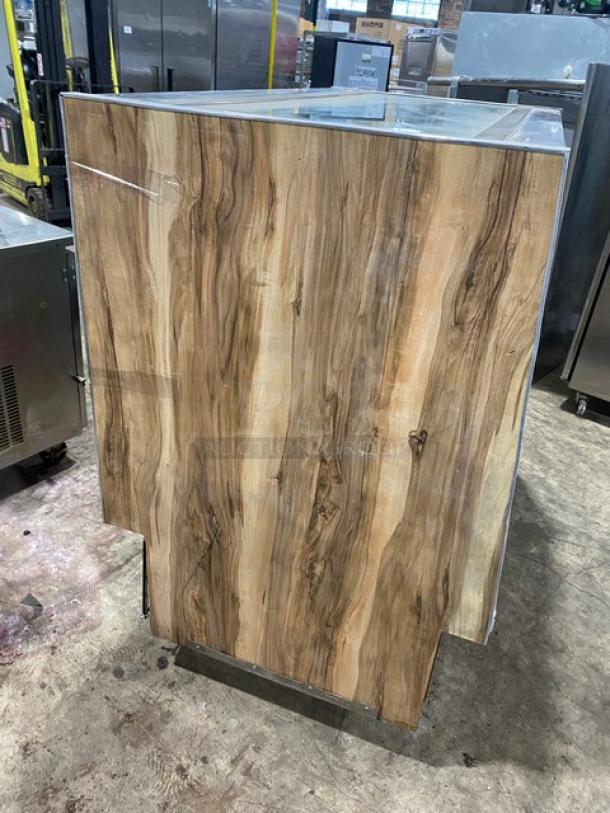 Marc SQBCR59 59" bakery display case with wooden finish, poly coated rack, rear sliding glass doors, 115V, 1 phase.