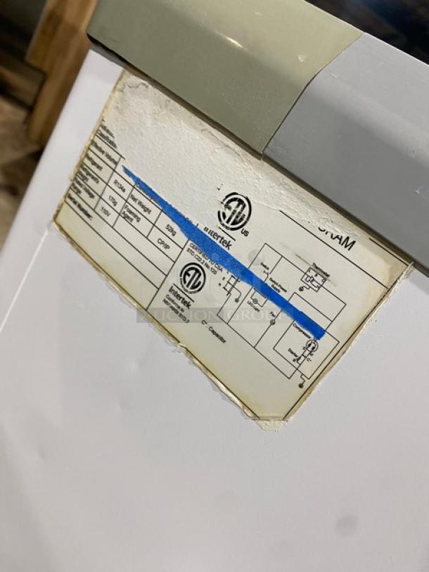 Commercial White Brooklyn Eatz 28" Ice Cream/Frozen Yogurt Merchandiser, dual sliding glass lid, 110V, on casters, ETL-certified label.