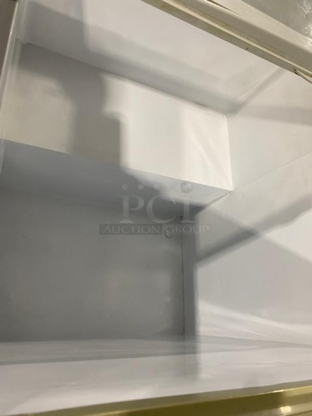 Commercial white Brooklyn Eatz style 28" ice cream display freezer, dual sliding glass lid, 110V, on casters.