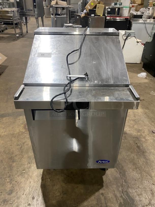 Atosa 2021 stainless steel single door prep table, Model MSF8305GR, with poly coated rack, on casters, good condition.