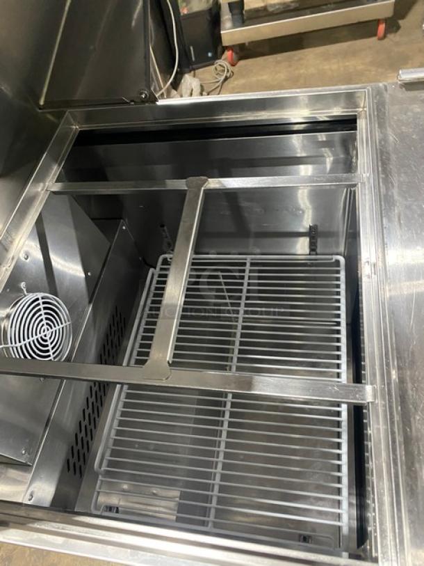 Atosa 2021 refrigerated bain marie prep table, model MSF8305GR, stainless steel, with poly-coated wire rack.