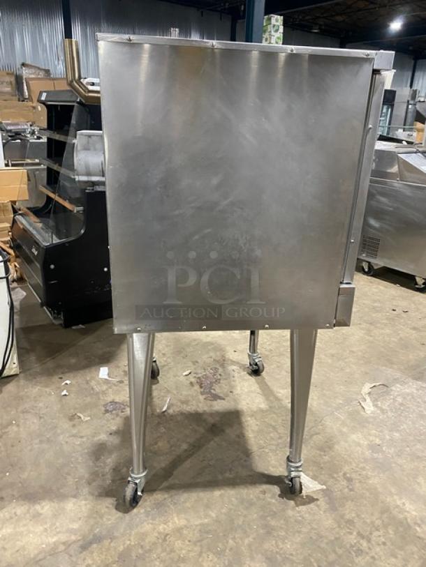 Imperial stainless steel gas-powered convection oven on casters. Includes a wired oven rack. Commercial-grade, single stack.