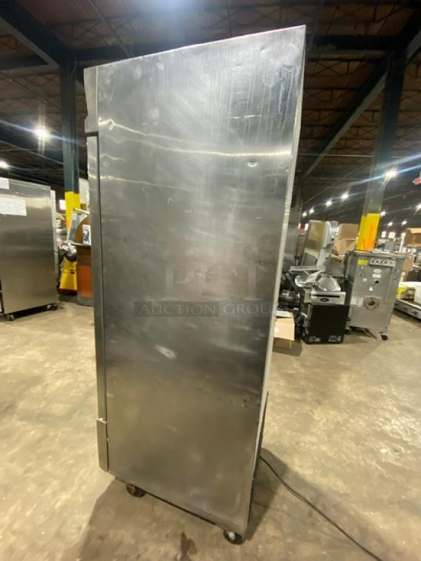 Entree CR1ES stainless steel single-door refrigerator, Energy Star certified, with poly-coated wire rack, on casters.