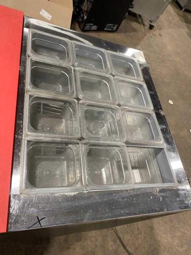 Continental SW3212M prep table with stainless steel worktop, red cutting board, clear food pans, and poly coated rack.