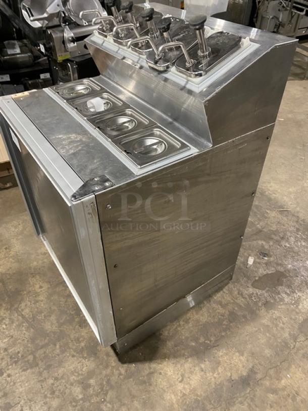 Silver King SKF2A stainless steel ice cream topping dispenser with pumps. Includes poly coated wired rack. 115V.