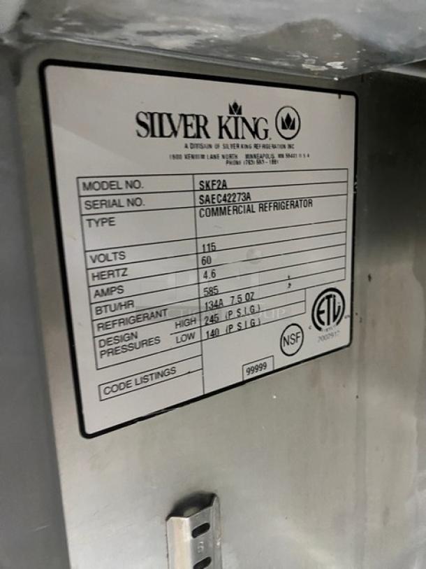 Silver King commercial stainless steel refrigerator, model SKF2A, with dispenser pumps and rack. Serial: SAEC42273A.
