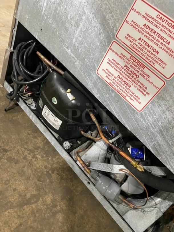 Silver King stainless steel ice cream topping dispenser, Model SKF2A, with dispenser pumps and poly-coated rack, 115V.