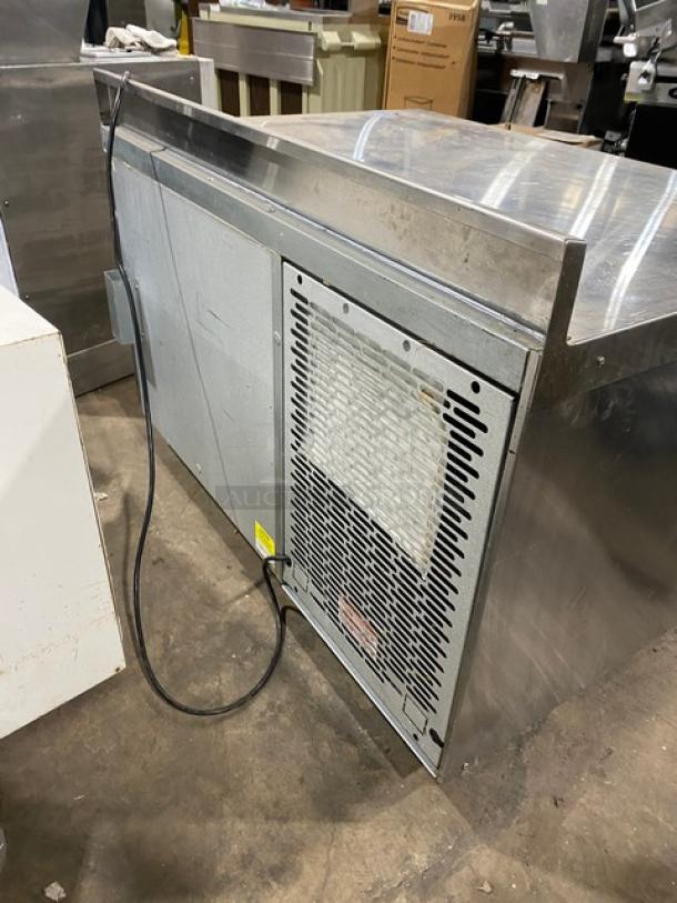 Traulsen TU048QC stainless steel single door 48" undercounter quick chiller with backsplash, poly coated rack, casters.