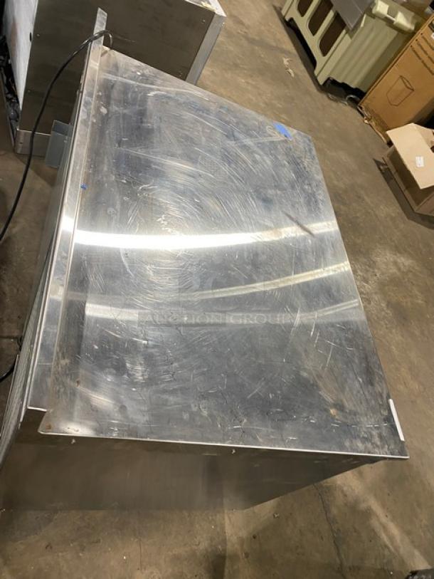 Traulsen TU048QC stainless steel quick chiller, 48", with backsplash, poly coated rack, on casters, used condition.