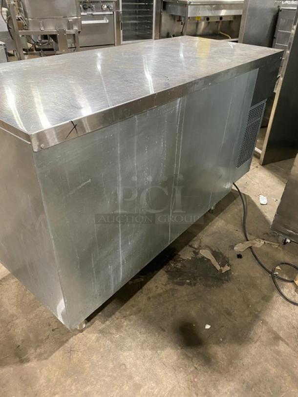 GlasTender stainless steel 2-door bar cabinet, model LP60L6SSLL. Features poly-coated wire racks, on legs, 120V, used condition.