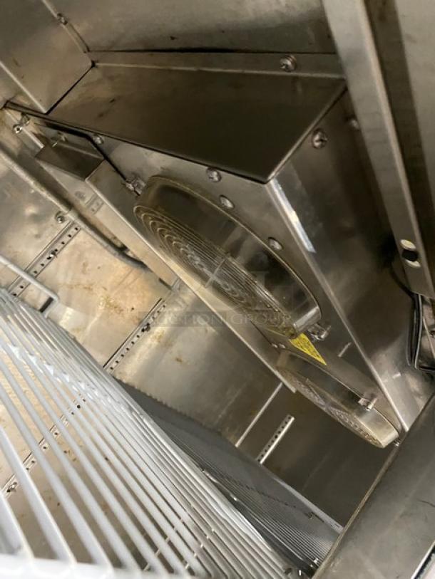 GlasTender stainless steel 2-door refrigerated back bar cabinet, model LP60L6SSLL, featuring a poly-coated wire rack.