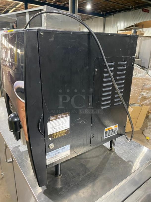 Bunn LCC-2LP black dual-flavor coffee dispenser with hot water feature, 120V, on legs, with visible model and serial number.