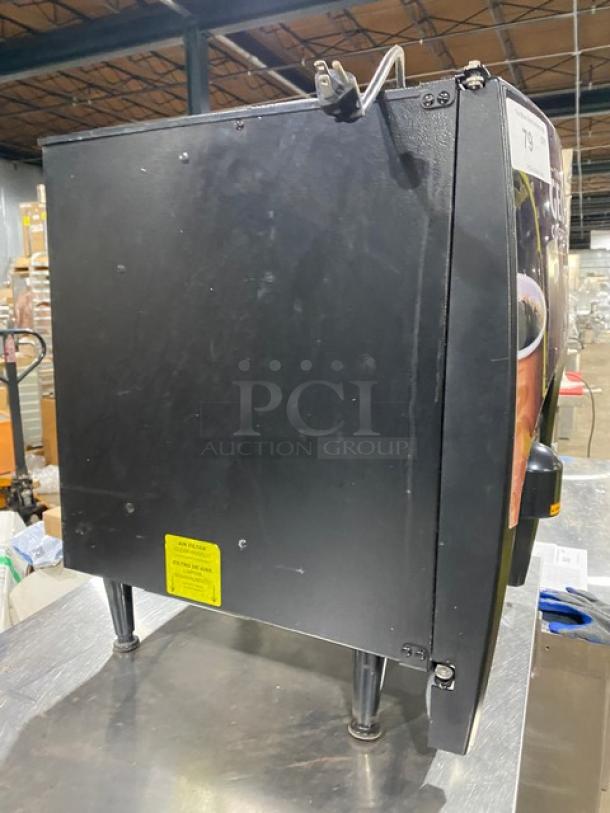 Bunn LCC2LP dual-flavor coffee dispenser, black, electric, with hot water dispenser, on legs, 120V, 1 phase, used condition.