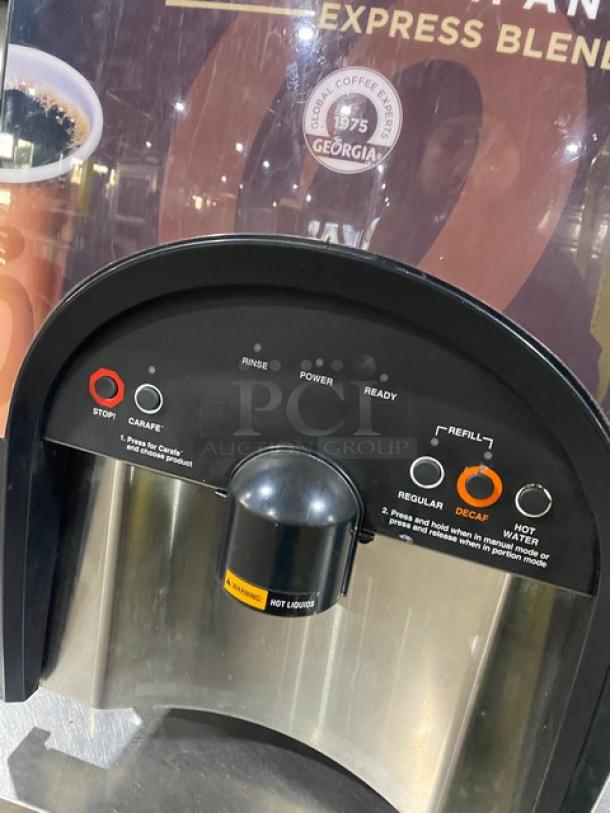 Bunn LCC-2LP black electric dual-flavor liquid coffee dispenser with hot water feature. 120V, 1 phase, on legs, model shown.