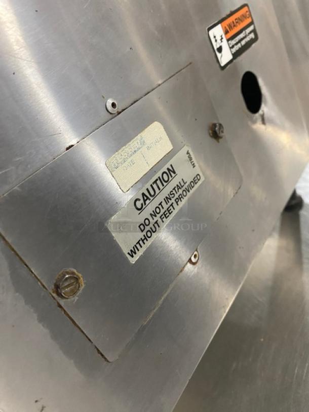 Cecilware stainless steel electric countertop dual burner hot plate, caution labels visible, mounted on legs.