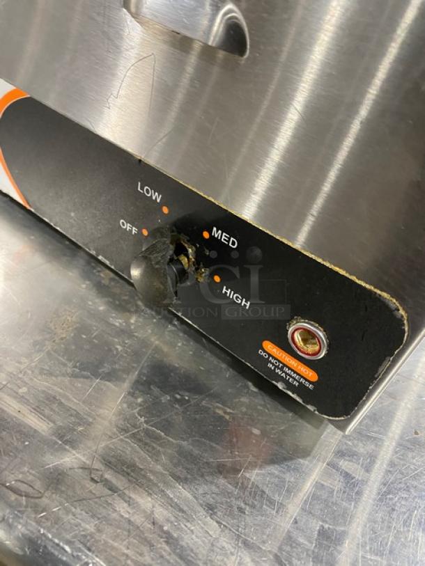 Nemco commercial stainless steel electric countertop single well hot food warmer with adjustable heat settings. Visible wear on control knob.