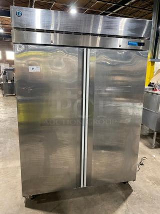Hoshizaki stainless steel 2-door reach-in refrigerator, model R2AFS, with poly coated rack, on casters, in good condition.
