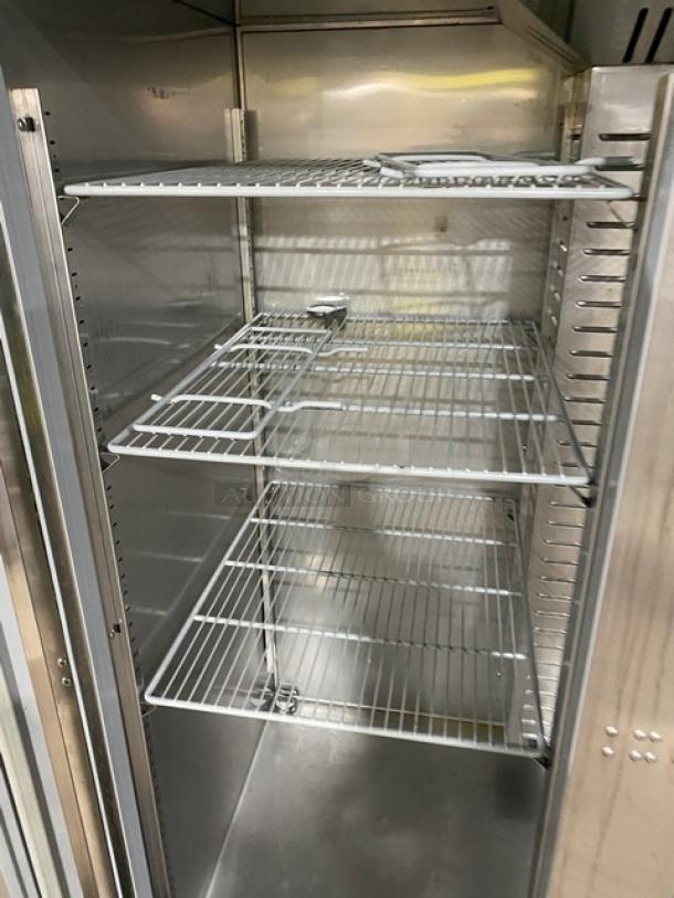 Hoshizaki R2A-FS stainless steel 2-door reach-in refrigerator, interior view with poly-coated wire racks, on casters.
