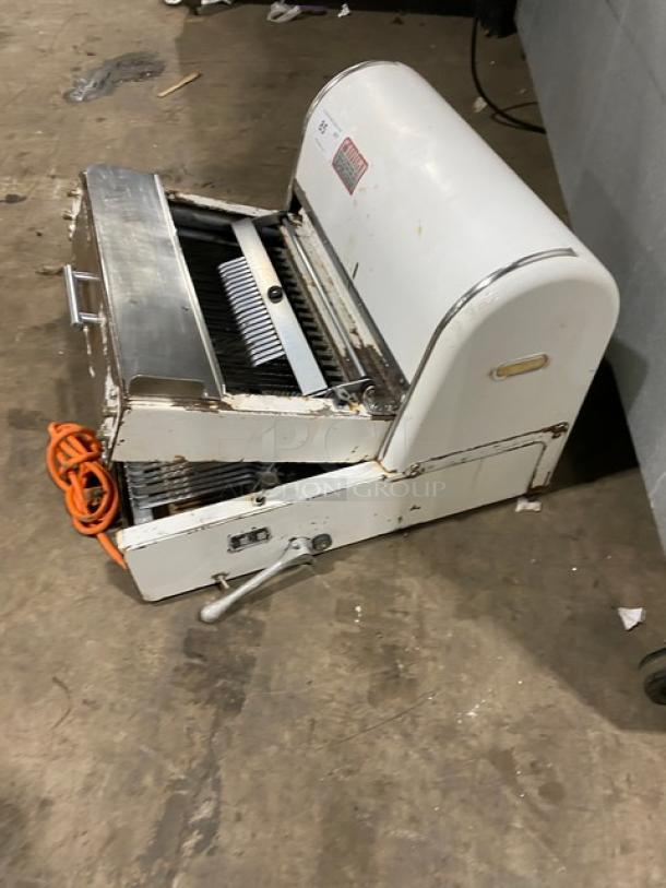 Berkel MB7/16 electric bread slicer, white, 7/16" slice size, used condition, 115V, 1 phase, visible wear, orange cord included.