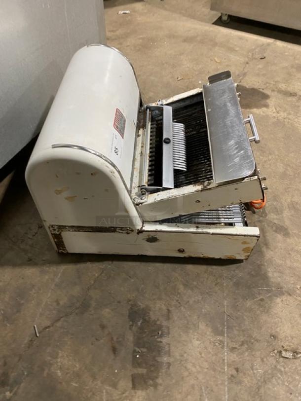 Berkel MB7/16 electric bread slicer, 7/16" cut, countertop model, white, used condition, visible wear, 115V, 1 phase.