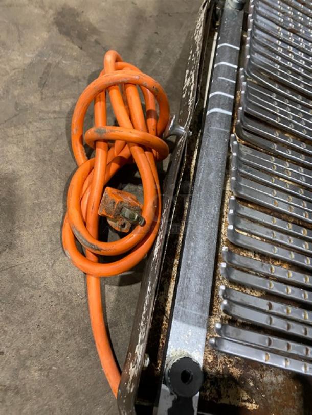 Berkel MB7/16 electric bread slicer with 7/16" blades, orange power cord; used condition, some rust visible.