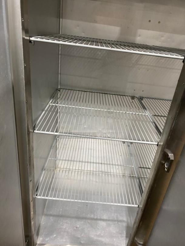 Traulsen G-Series 3 Door Reach-In Freezer, model G31011, with poly coated wire rack, stainless steel, on casters.