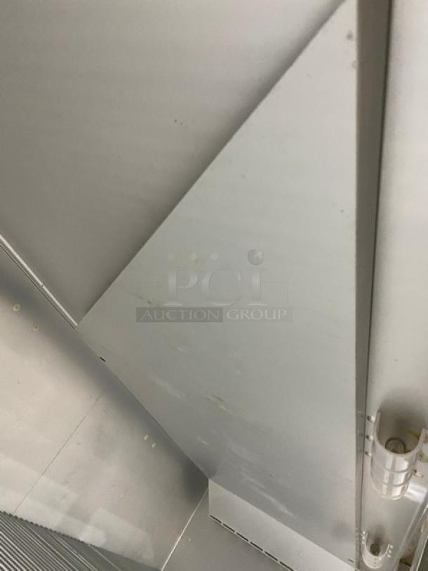 Traulsen G-Series 3-Door Reach-In Freezer, stainless steel, model G31011, poly coated wired rack, on casters.