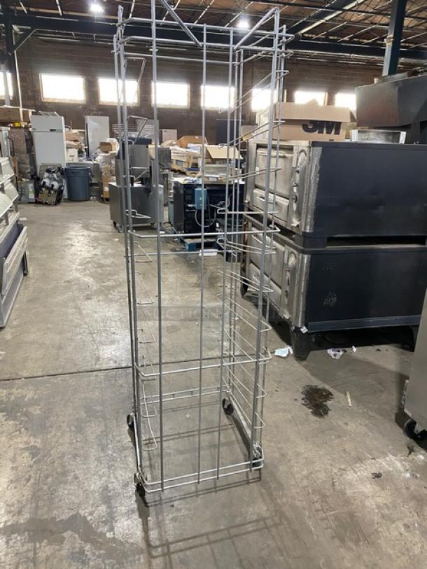 Commercial steel flat wire bread rack on casters, featuring multiple shelves in a durable metal construction, good condition.