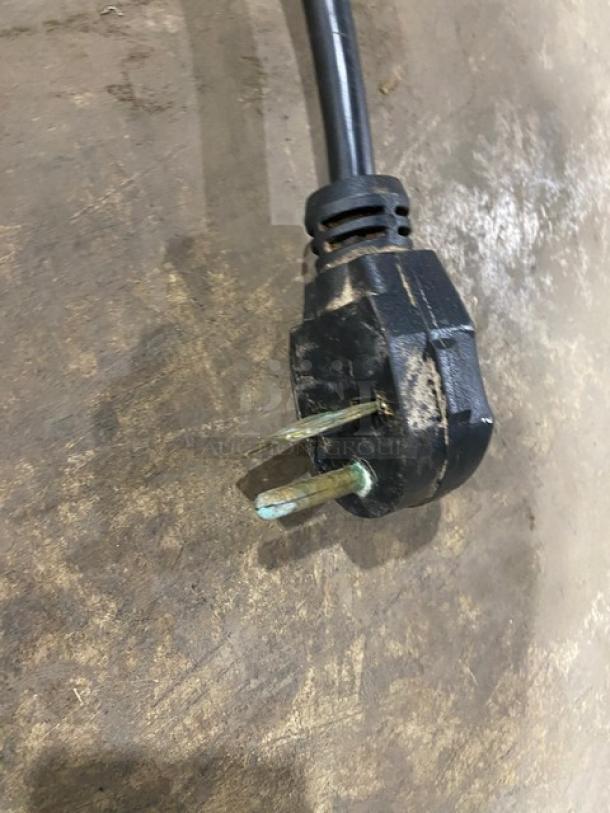 Electric plug for MerryChef EikonE3 rapid cook oven, 208/240V, showing wear. Essential for connecting appliance to power.