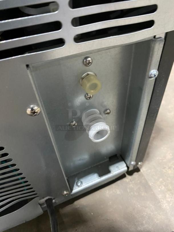 Maxx Ice MIM50 scratch-n-dent ice maker rear view. Features stainless steel body, Energy Star certification, 115V plug. Model SN: 00500420057.