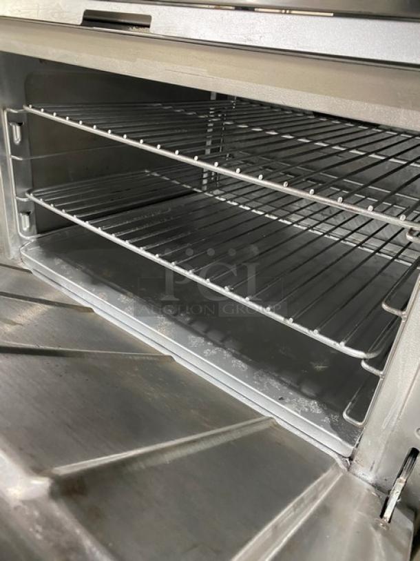 CPG 351S36N stainless steel 6-burner range/oven combo, natural gas, 36", with wired oven rack, on legs, SN: 03224046.