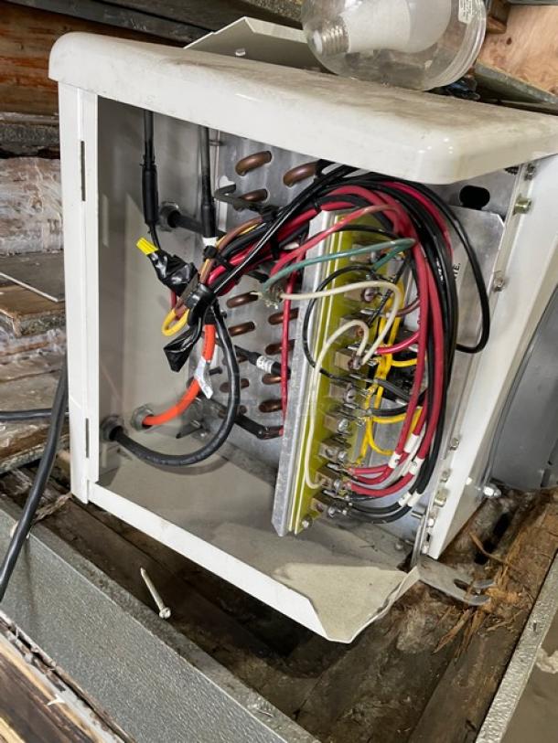 Commercial heavy-duty 8'x8' walk-in freezer in fair condition, includes blower, lacks compressor, wiring visible.