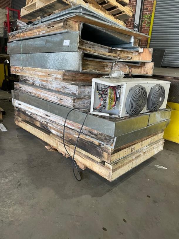 Commercial 8'x8' walk-in freezer, includes blower, missing compressor, stacked panels, used condition.