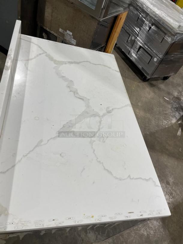 Atosa 2022 stainless steel 2-door undercounter freezer with marble-style worktop, upturned backsplash, and poly-coated rack. Model MGF8406GR.