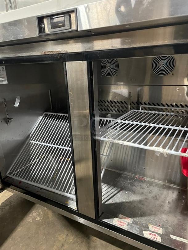 Atosa 2022 commercial stainless steel 2-door undercounter freezer, model MGF8406GR, with marble style worktop and backsplash.