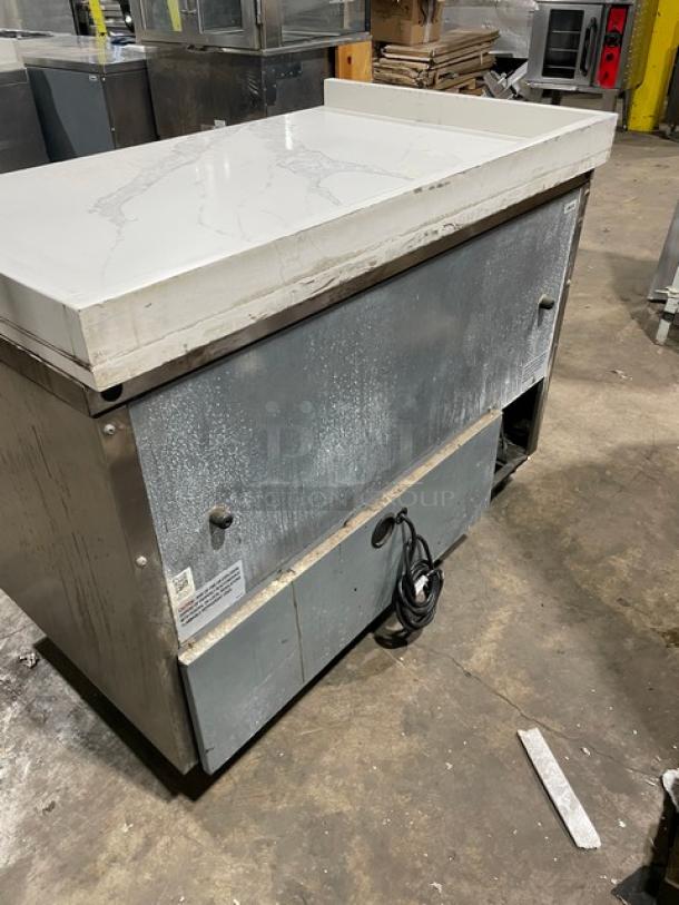 True TUC-48F-D-4-HC worktop freezer, stainless steel, 48", marble style top, up-turned splash, on casters, 115V, 1 phase.