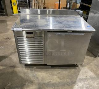 Traulsen TU048QC stainless steel undercounter quick chiller, 48", with back splash, poly-coated rack, on casters, 115V, 1 phase.
