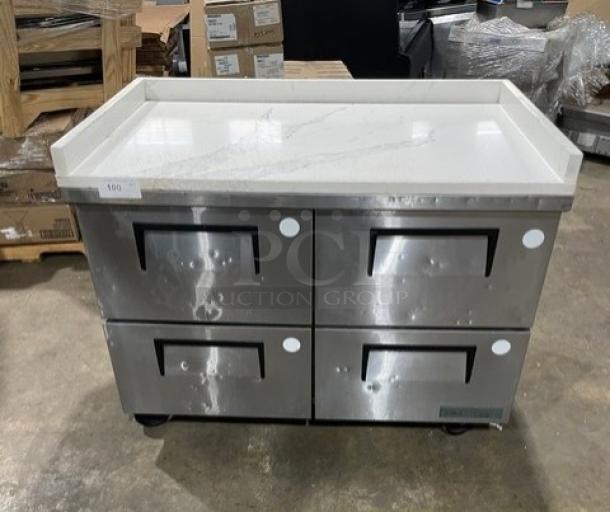 True commercial stainless steel 4-drawer undercounter freezer with marble-style worktop and upturned splash, model TUC-48F-D-4-HC.