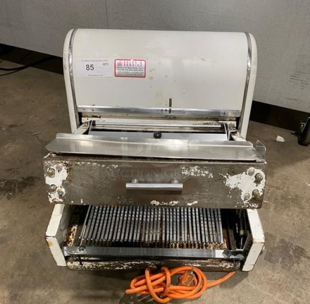 Berkel MB7/16 bread slicing machine, electric-powered, countertop model, visible wear, 115V, 1 phase, orange power cord.