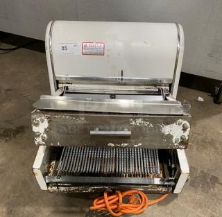 Berkel MB7/16 bread slicing machine, electric-powered, countertop model, visible wear, 115V, 1 phase, orange power cord.