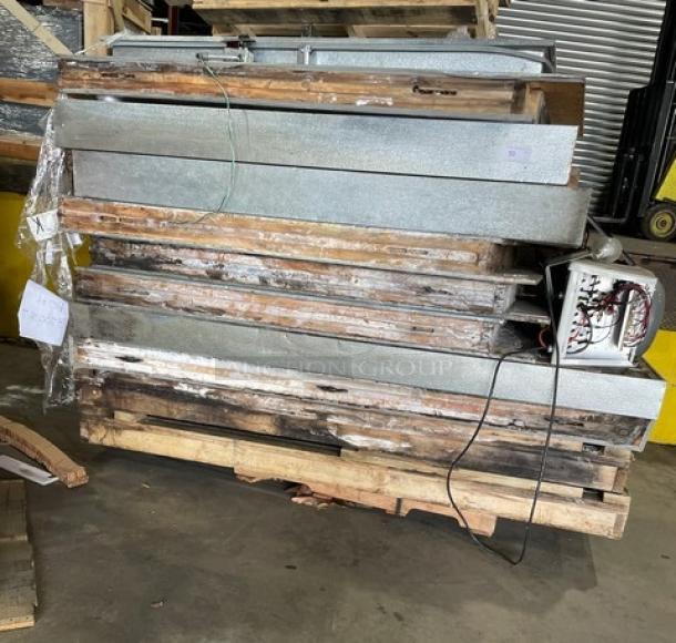 Commercial heavy-duty 8'x8' walk-in freezer components with blower, missing compressor, moderate wear, on pallet.