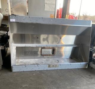Commercial stainless steel kitchen exhaust hood, used condition. Visible vent opening, sturdy construction, ideal for restaurant use.