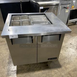 True Commercial Stainless Steel 2-Door Refrigerated Prep Table, Model TSSU-36-12M-B, on casters, with hotel pan compartments.