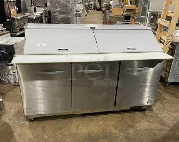 Kool-It Ikon Series 3 Door Stainless Steel Refrigerated Prep Table, Model KSP72M, with cutting board and rack, on casters.