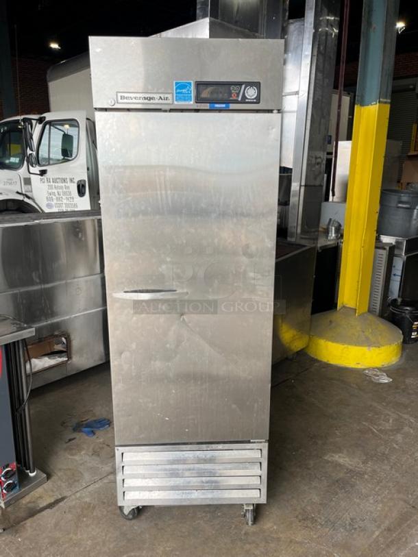 Beverage-Air KF24-1AS commercial stainless steel reach-in freezer, single door, on casters, with poly coated wire rack.