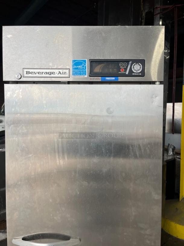 Beverage-Air stainless steel single door reach-in freezer, model KF24-1AS, on casters, with poly coated wire rack.