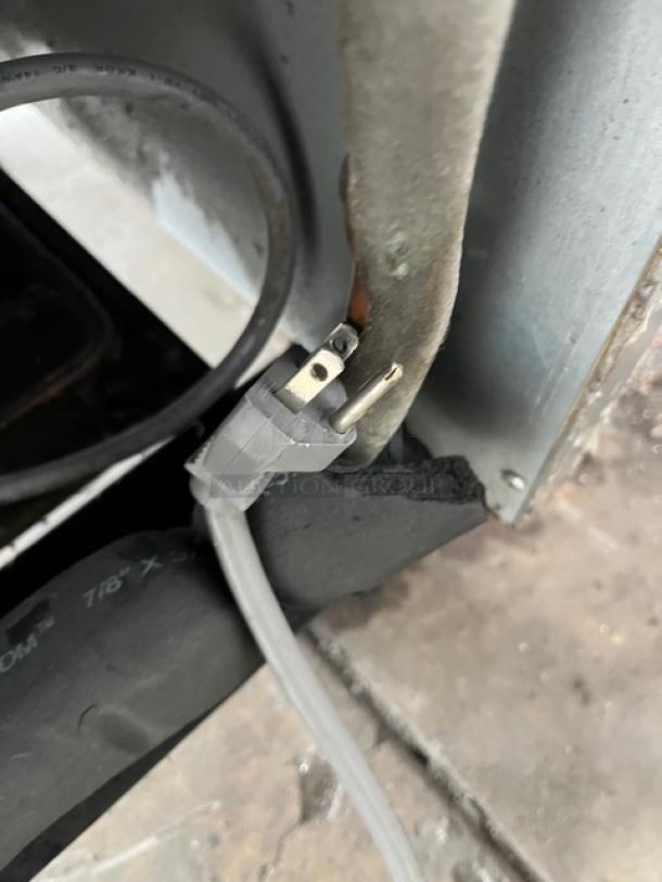 Beverage-Air freezer power cable and plug detail, model KF24-1AS, part of a commercial stainless steel reach-in freezer.