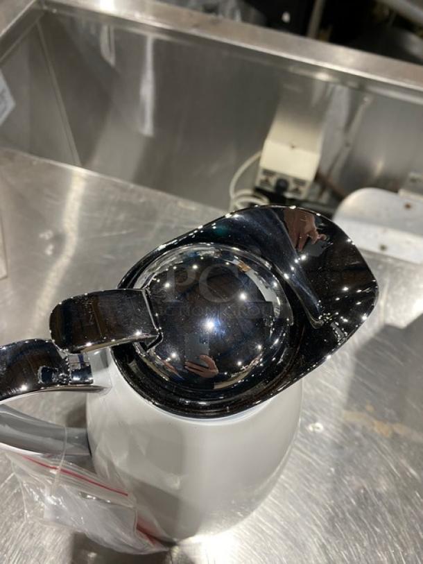 New Service Ideas Marquette Series 1-Liter Insulated Coffee Carafe, polished chrome finish, pristine condition.